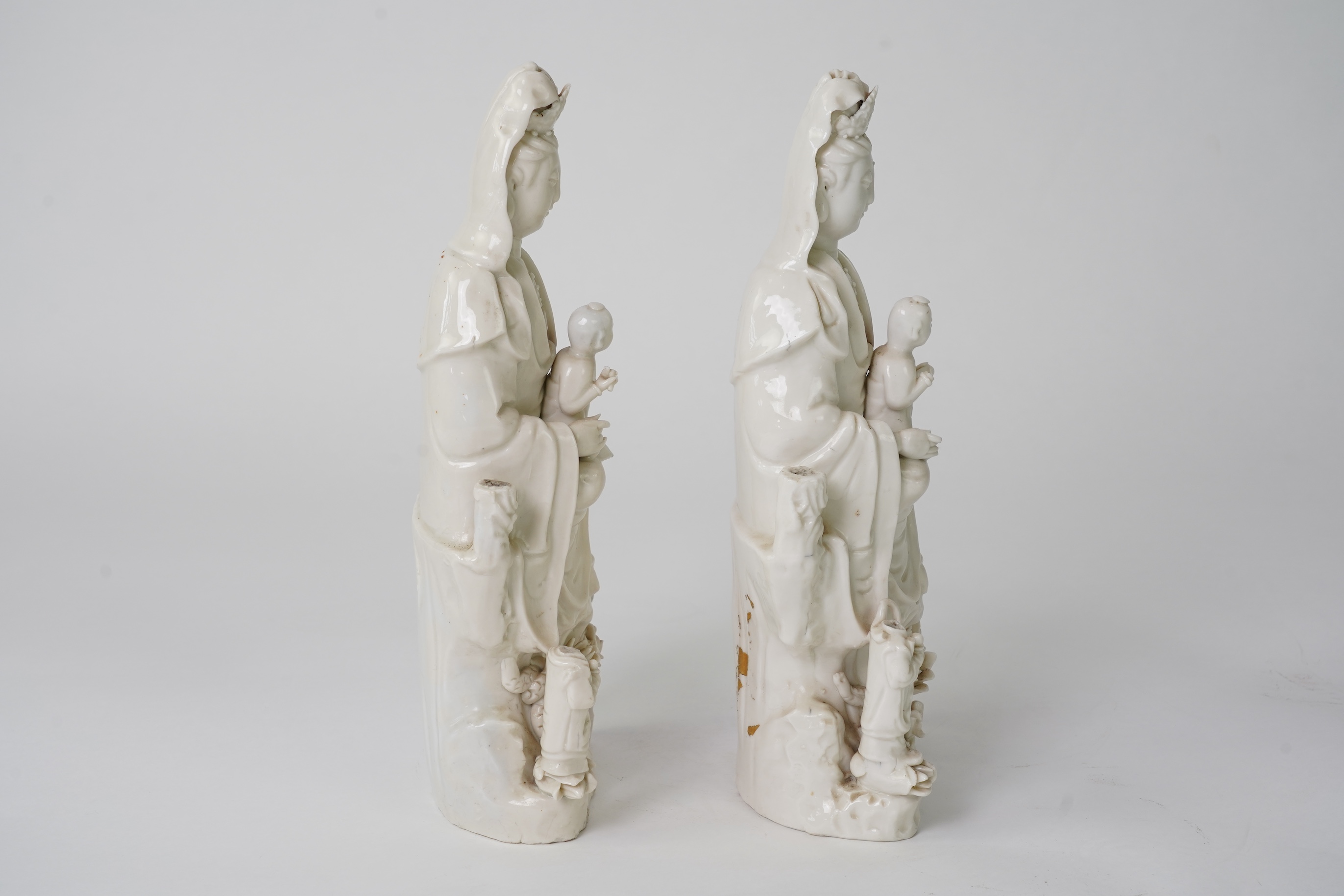 A pair of Chinese blanc de chine groups of Guanyin and children, 18th century
